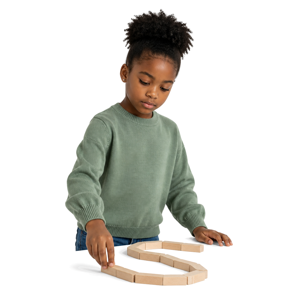 A child building a planned path of blocks